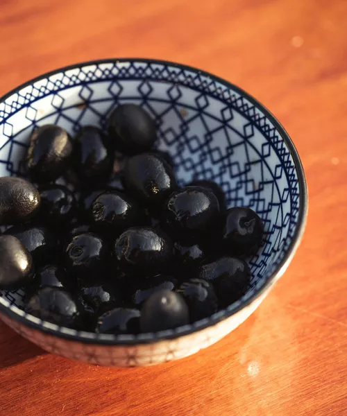Black Atlas olives preserved by salt-curing